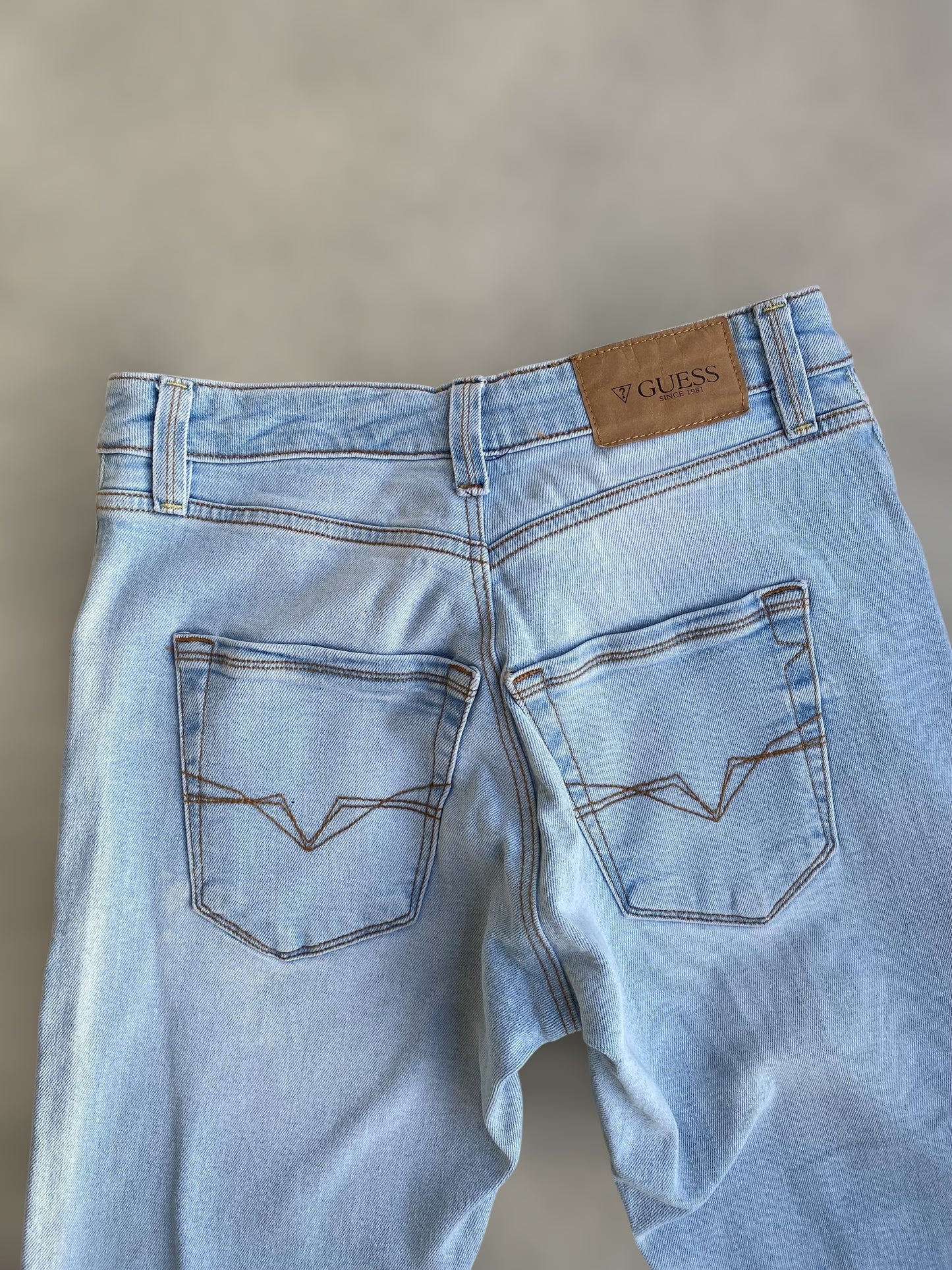 Guess ligh washed low waisted jeans