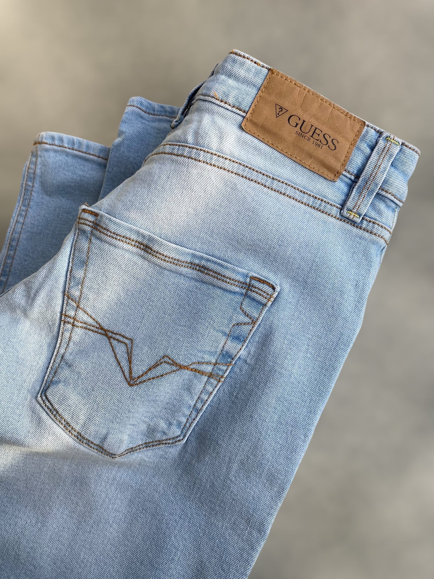 Guess ligh washed low waisted jeans
