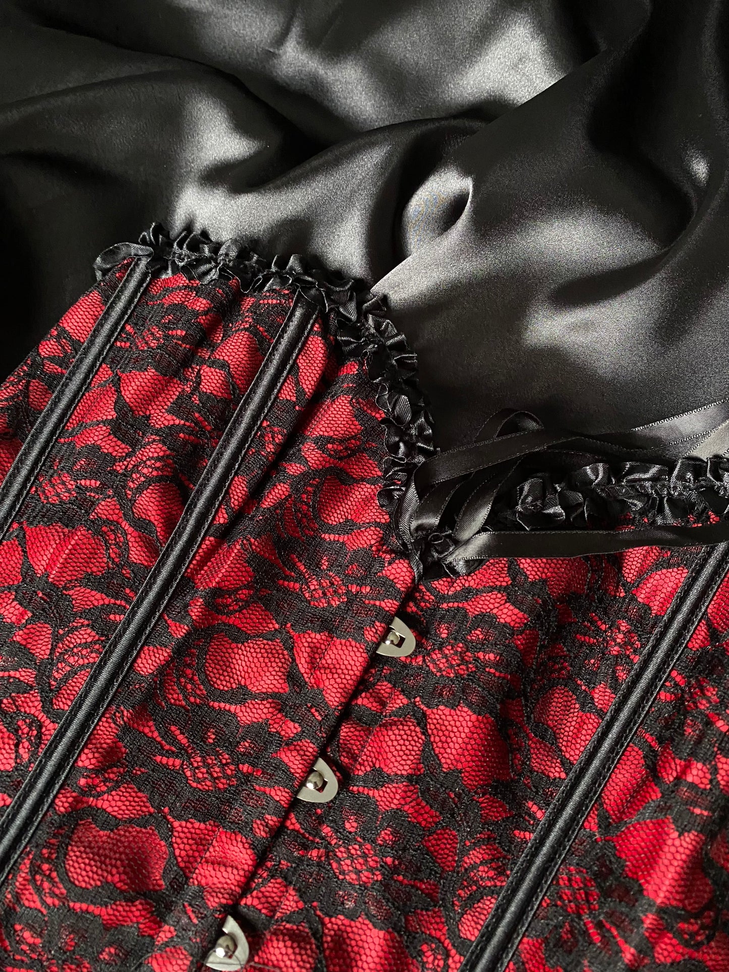 Black and red lace corset